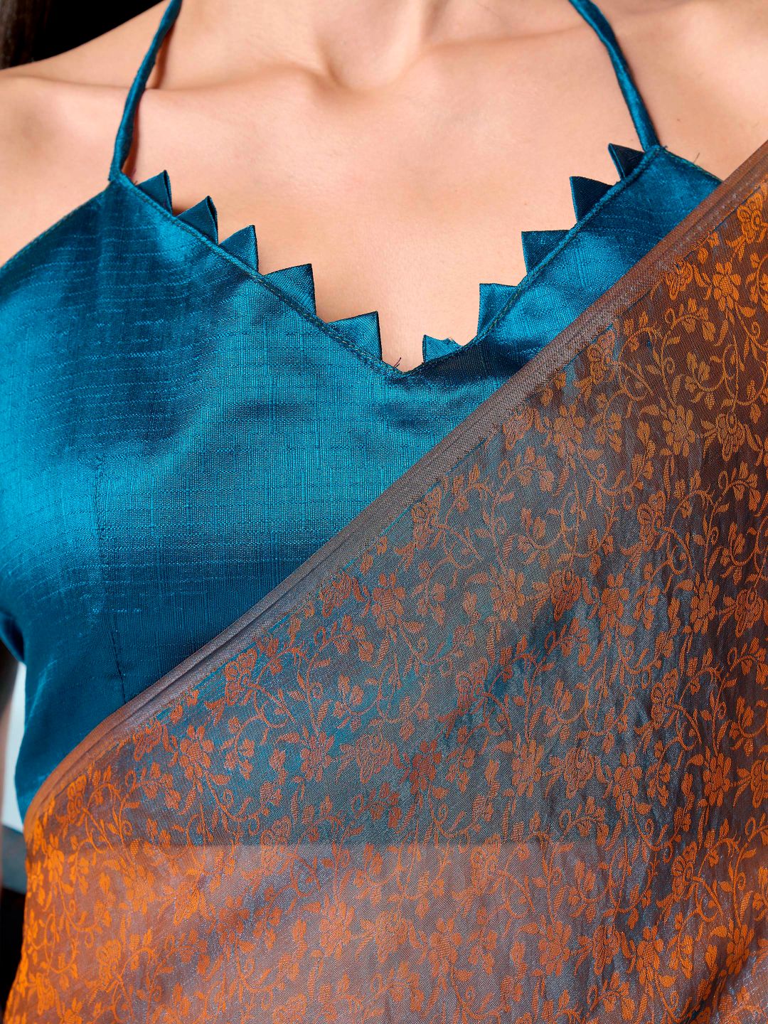 Two tone teal and orange colored woven saree with tassles on pallu